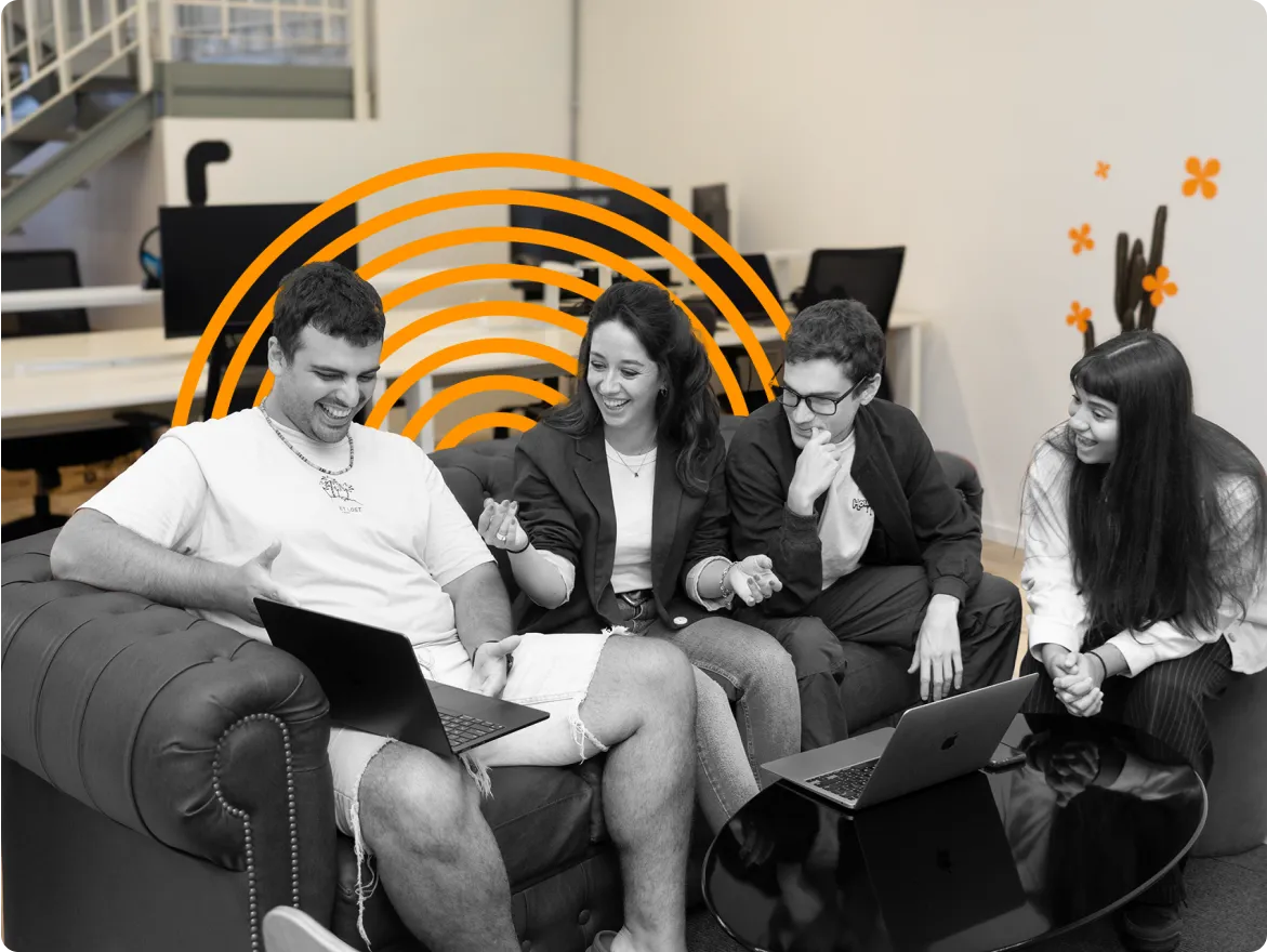 People working on a comfortable sofa